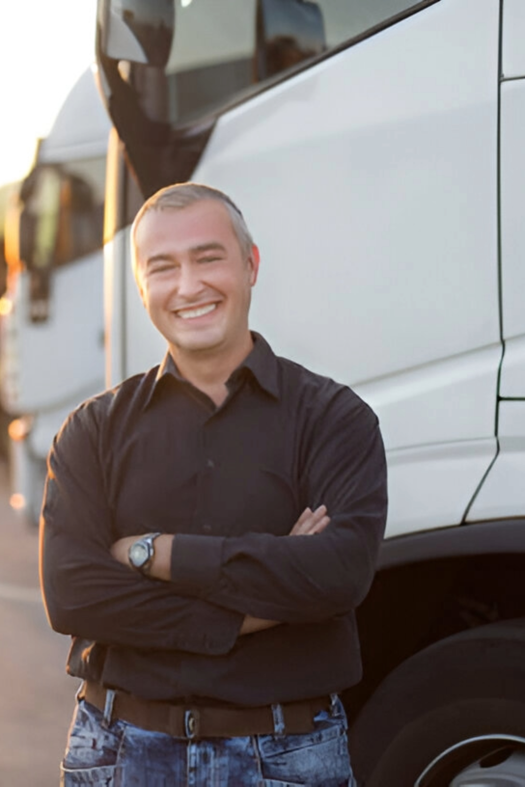 Man in Black shirt Standing next to Truck